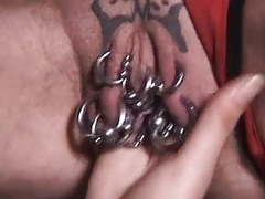 UhFuck presents: Pierced granny with lots of genital piercings fisted