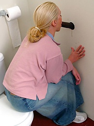 UhFuck presents: Blonde girl Jamie sits on the toilet and blows a black gloryhole dong